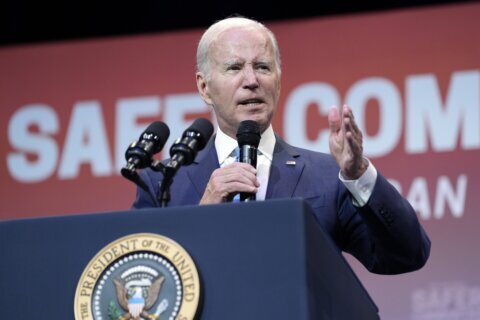 Biden strikes economic populist tone during campaign rally before exuberant union members