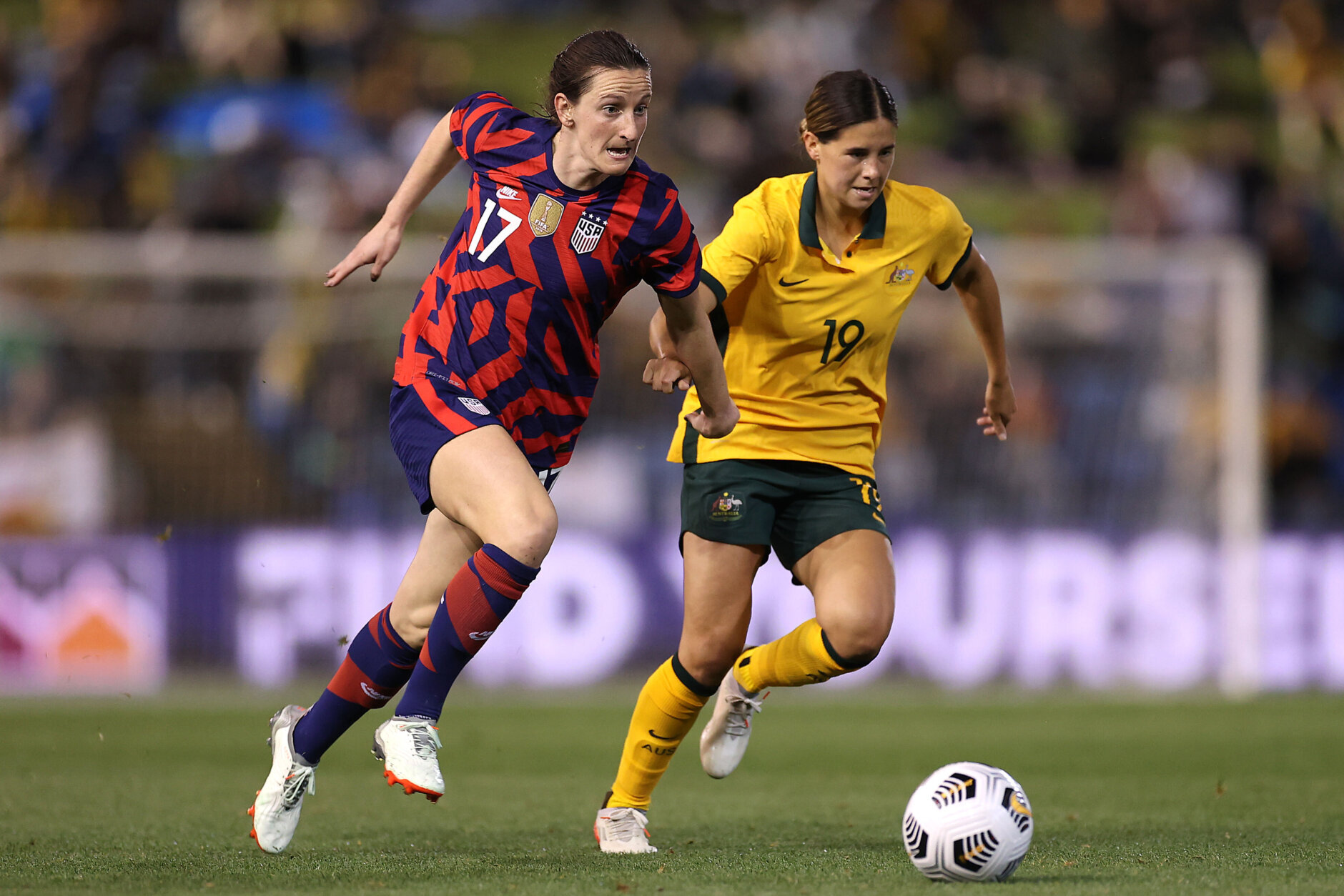 NEWCASTLE, AUSTRALIA - NOVEMBER 30: Andi Sullivan of the United States dribbles the ball in front of Kyra Cooney-Cross of the Matildas during game two of the International Friendly series between the Australia Matildas and the United States of America Women's National Team at McDonald Jones Stadium on November 30, 2021 in Newcastle, Australia. (Photo by Mark Kolbe/Getty Images)