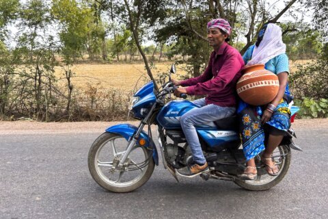 Nearly 100 die as India struggles with a sweltering heat wave in 2 most populous states