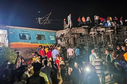 Passenger train derails in India, killing at least 50 and trapping many others