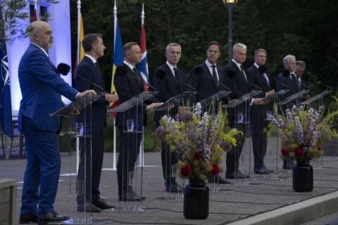 NATO chief convenes talks in a bid to persuade Turkey to let Sweden join the military alliance