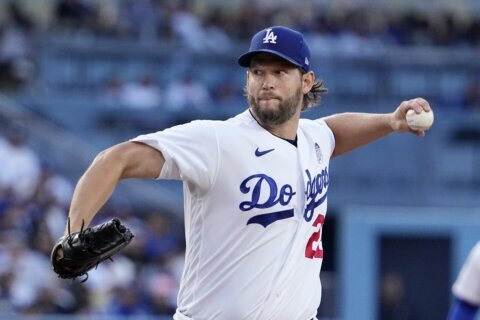 Clayton Kershaw throws a bullpen session as he works toward return from sore shoulder