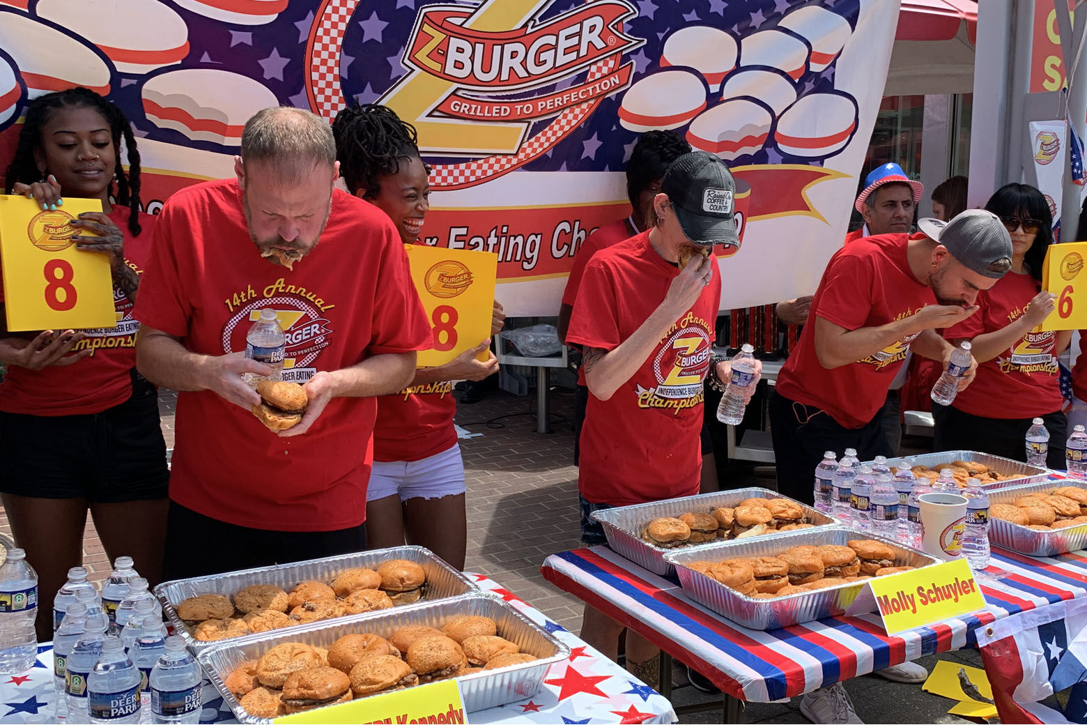 Contestants started eating the dozens of burgers outside of the Tenleytown Z-Burger