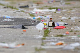 Party debris is seen in the area of a mass shooting incident in the Southern District of Baltimore, Sunday, July 2, 2023. Police say a number of people were killed and dozens were wounded in a mass shooting that took place during a block party just after midnight. (AP Photo/Julio Cortez)
