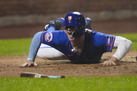 Canha’s sacrifice fly after rain delay lifts Mets to 2-1 win over Nationals