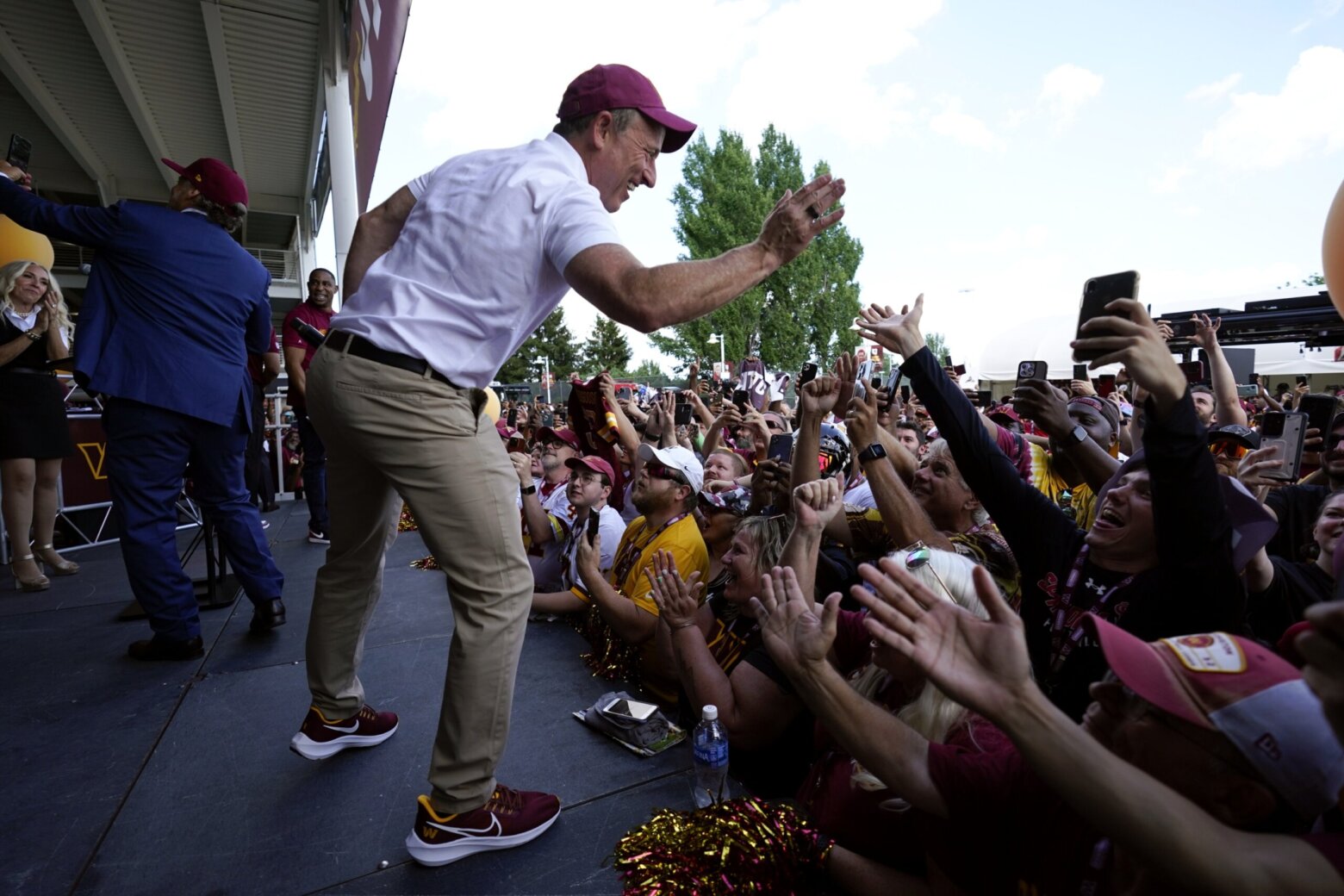 Washington Commanders fans celebrate deal to sell