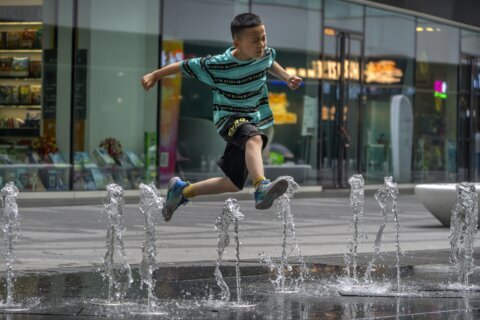 Flooding displaces 10,000 around China as Beijing gets a relative respite from sweltering heat