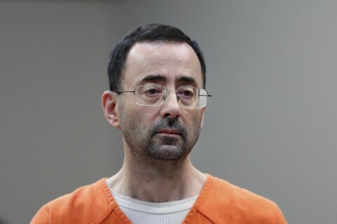 Suspect in Larry Nassar stabbing said ex-doctor made lewd remark watching Wimbledon, AP source says
