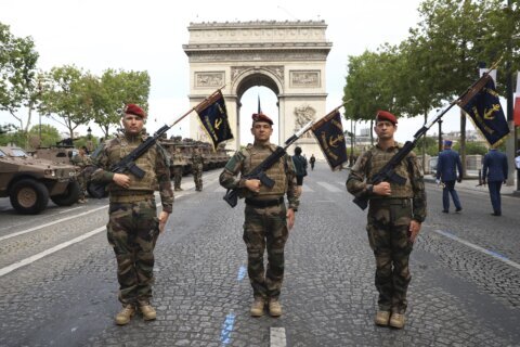 France celebrates Bastille Day with parades and parties - and extra police, after recent unrest