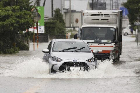Heavy rains cause flooding and mudslides in southwest Japan, leaving 2 dead and at least 6 missing