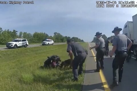 Ohio officer fired after letting his police dog attack a surrendering truck driver