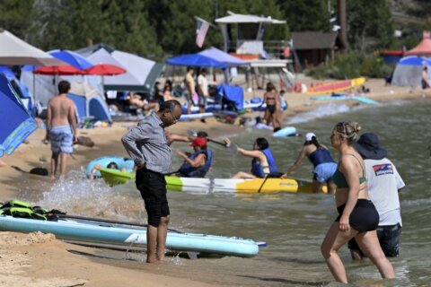 A travel guide's warning to avoid Lake Tahoe may jolt the region into managing huge tourist crowds