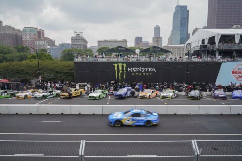 Heavy rains flood Chicago roads and force NASCAR to cut short a downtown street race