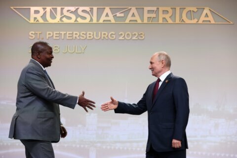 Putin woos African leaders at a summit in Russia with promises of expanding trade and other ties