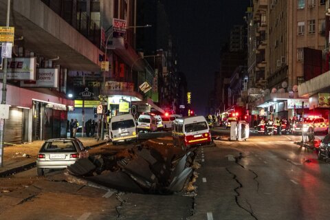 Suspected gas explosion in Johannesburg rips open roads and flips cars during rush hour, injuring 9