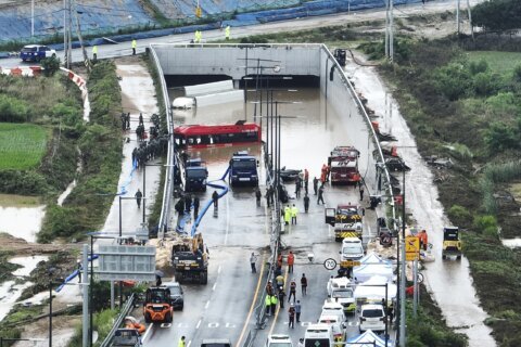 9 bodies pulled from a flooded road tunnel in South Korea as rains cause flash floods and landslides