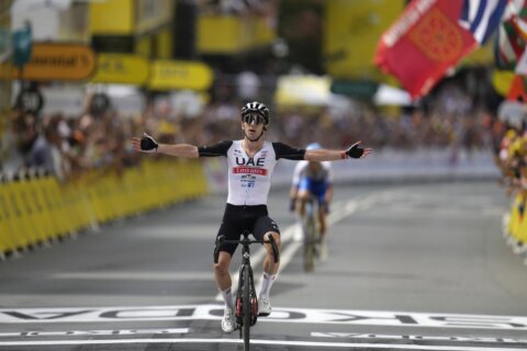 Adam Yates beats twin brother Simon Yates to win first stage of Tour de France