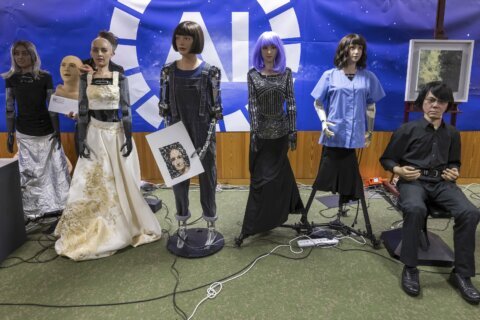 UN tech agency rolls out human-looking robots for questions at a Geneva news conference