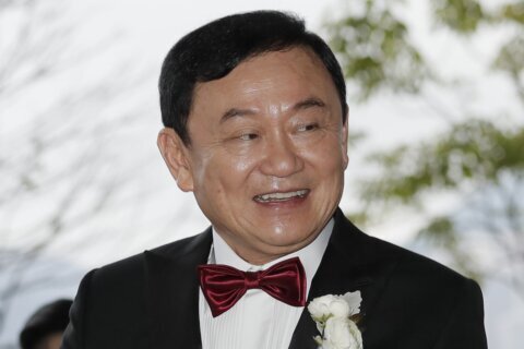 Former Thai leader Thaksin goes to jail as political party linked to him wins vote to take power