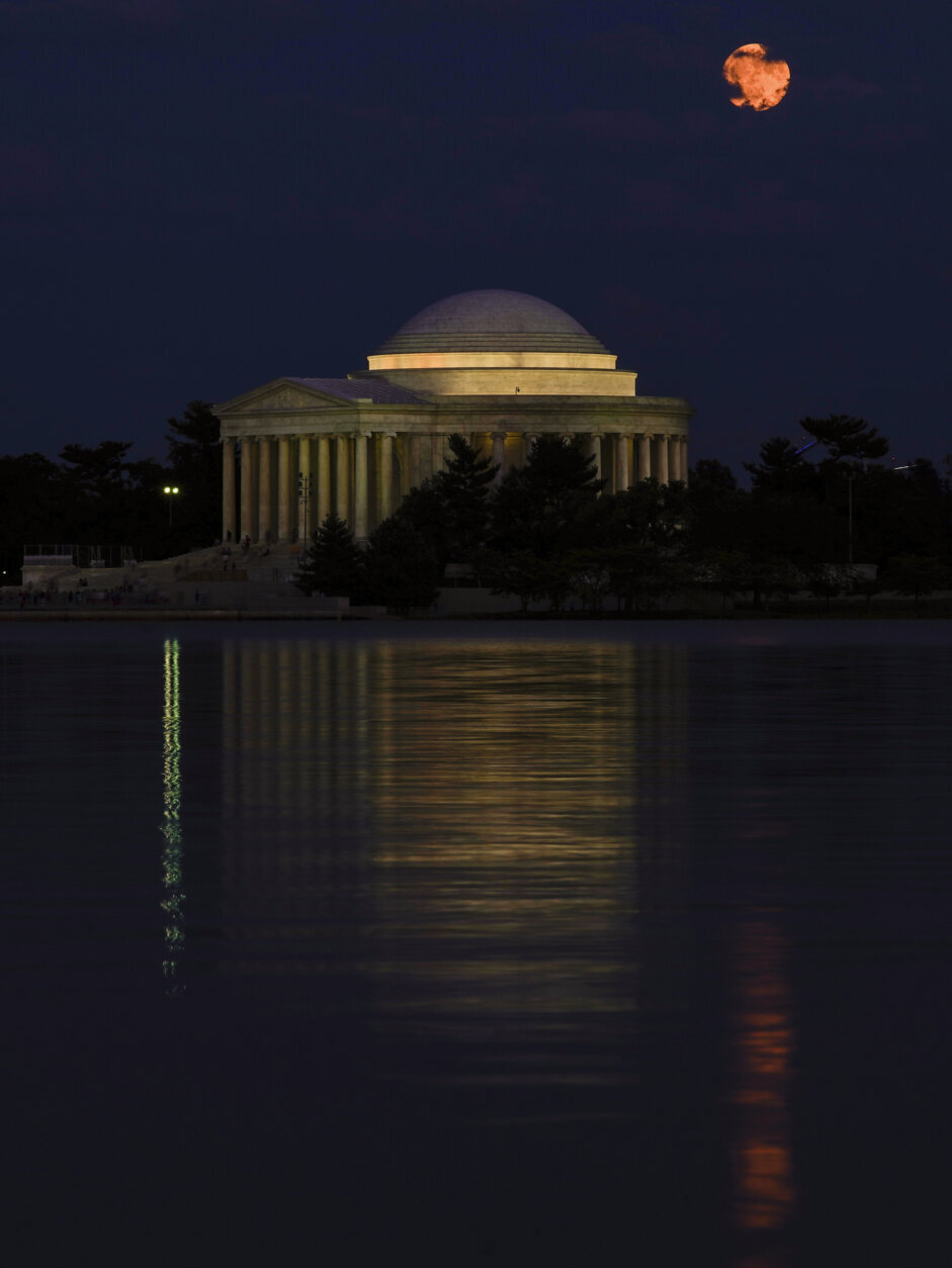 The waxing Sturgeon supermoon rises above the Tidal Basin and the Thomas Jefferson Memorial in Washington, late Monday, July 31, 2023. (AP Photo/Carolyn Kaster)