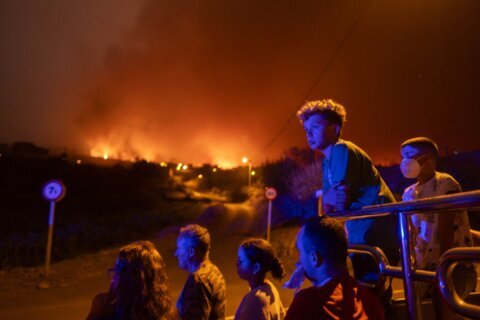 Gale-force winds are fanning dozens of wildfires across Greece, leaving 2 dead, 2 injured