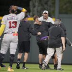 Ronald Acuña Jr. knocked over by fan charging field in Colorado