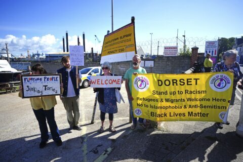 The UK government moves asylum-seekers to a barge moored off southern England in a bid to cut costs