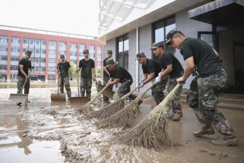 China evacuates residents and searches for mudslide victims as storms lash parts of the country