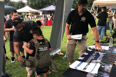 ‘Have a community that fights for each other’: Md. Gov. Moore joins residents at National Night Out event