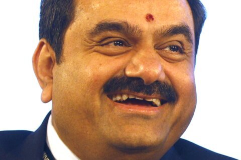 Report says close associates of India's Adani Group secretly purchased large numbers of shares