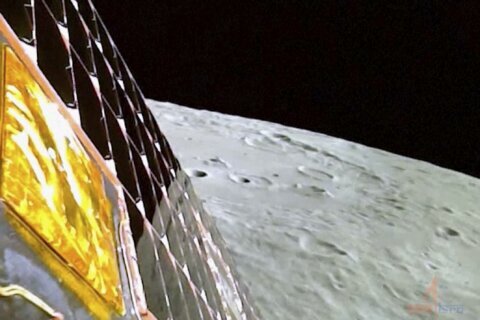 India's lunar rover goes down a ramp to the moon's surface and takes a walk