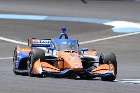 Scott Dixon holds off hard-charging Rahal to win Indianapolis GP on record-breaking day