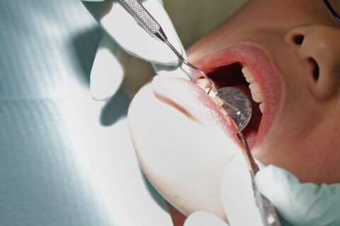 Woman sues dentist over visit she says included 4 root canals, 8 crowns, 20 fillings