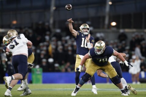 Hartman throws 4 TD passes as No. 13 Notre Dame opens with a 42-3 win over Navy in Ireland