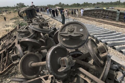 Rail service in southern Pakistan is partially restored after train crash that killed 30 people