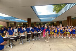 As the school's band and cheerleaders led a pep rally, Principal Tracey Phillips said she is "all about making the excitement last throughout the first day and throughout the school year." (WTOP/Luke Lukert