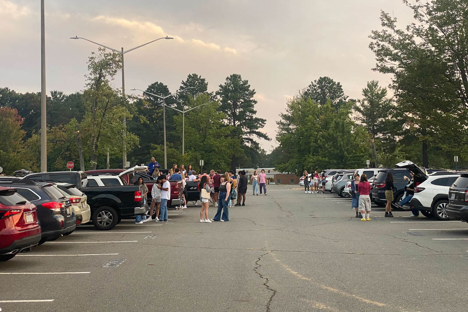 Robinson Secondary School seniors gathered in the parking lot early Monday morning to watch the sunrise as a graduating class.(WTOP/Luke Lukert)