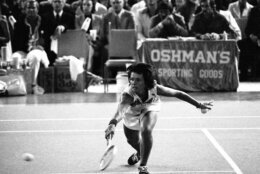 FILE - In this Sept. 20, 1973, file photo, Billie Jean King reaches to hit a return during her match against Bobby Riggs in the Astrodome in Houston, Texas. King beat Riggs 6-4, 6-3, 6-3. (AP Photo/File)