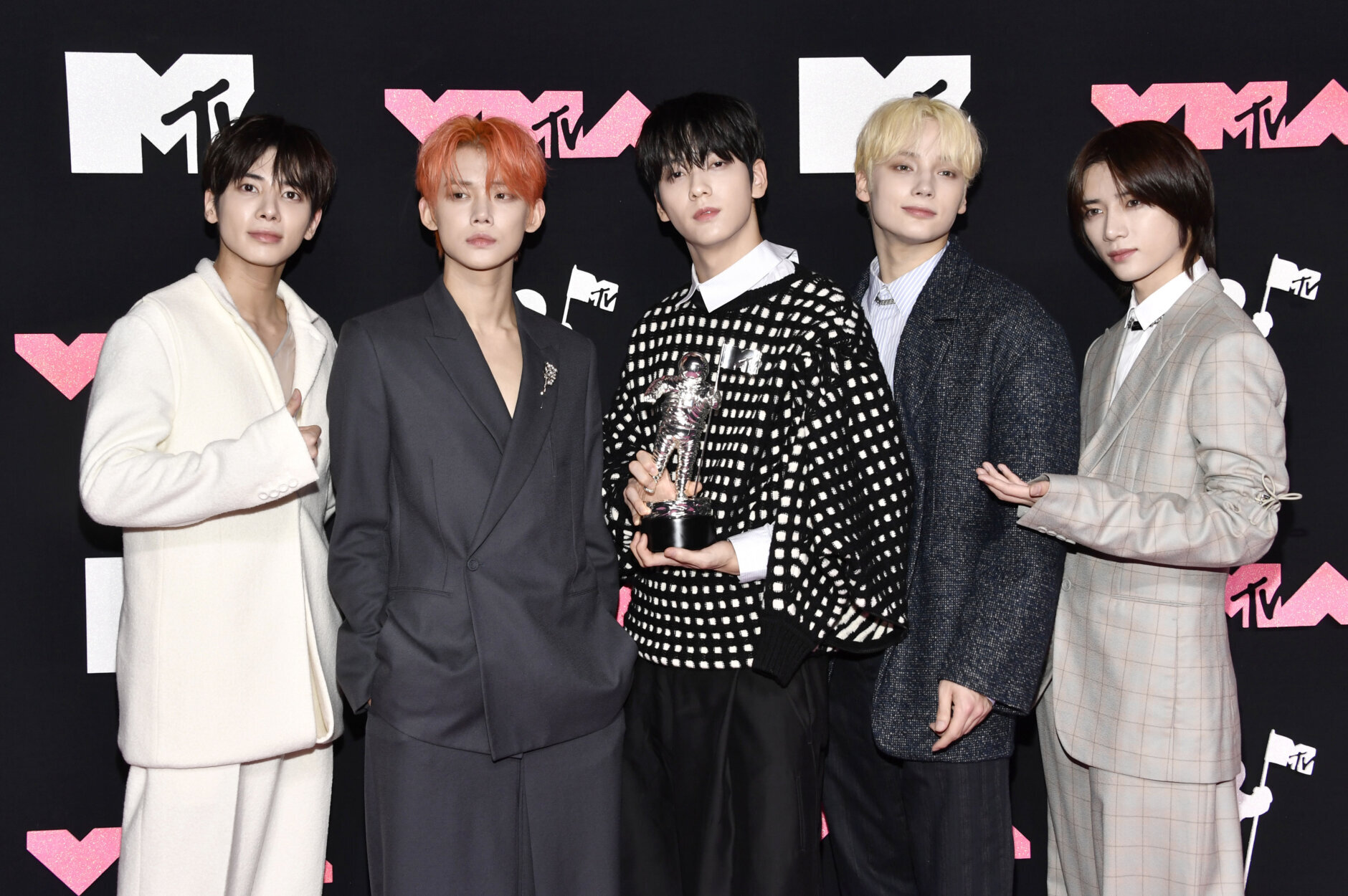Tomorrow X Together, winners of the award for push performance of the year for "Sugar Rush Ride," arrive at the MTV Video Music Awards on Tuesday, Sept. 12, 2023, at the Prudential Center in Newark, N.J. (Photo by Evan Agostini/Invision/AP)