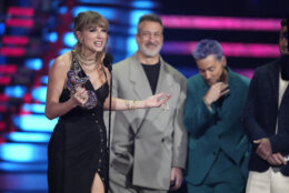 Taylor Swift accepts the award for best pop for "Anti-Hero"during the MTV Video Music Awards on Tuesday, Sept. 12, 2023, at the Prudential Center in Newark, N.J. Joey Fatone, center, and Lance Bass look on from right.(Photo by Charles Sykes/Invision/AP)