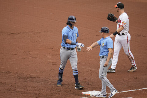 Orioles and Rays both clinch playoff berths when Rangers lose to Guardians
