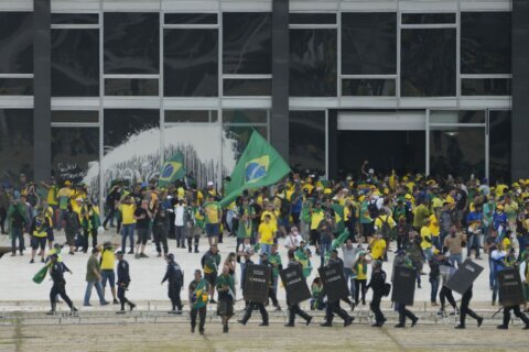 Brazil's top court imposes 17-year sentence, in first case against rioters who stormed the capital