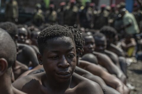 Two military officers are arrested in Congo for leading a protest crackdown that killed 43 people