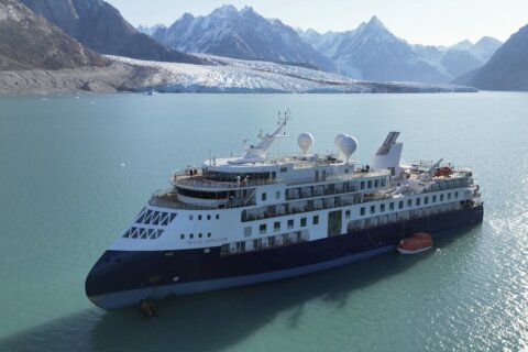Stranded luxury cruise ship MV Ocean Explorer is pulled free at high tide in Greenland