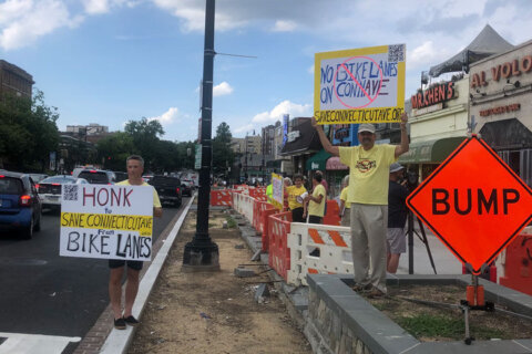 ‘Save our businesses’: Bike lane plans draw protesters to Connecticut Avenue