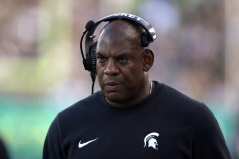 Michigan State suspends coach Mel Tucker after allegations he sexually harassed a rape survivor