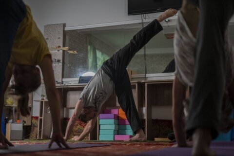 Yoga in a basement helps people in a Ukrainian front-line city cope with Russia’s constant shelling