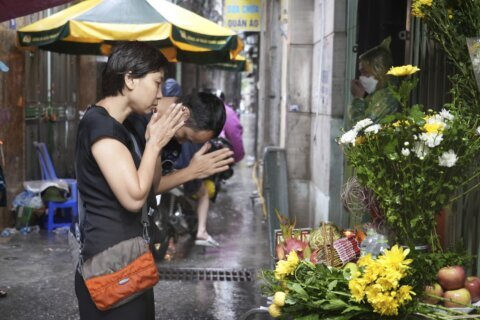 Witnesses say victims of a Hanoi high-rise fire jumped from upper stories to escape the blaze