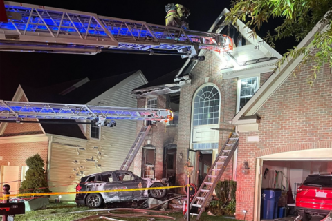 Police: Man in stolen BMW crashes into Fairfax Co. front yard, starts house fire