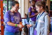 More than 600 middle school girls from across the region gathered at the Hylton Performing Arts Center in Prince William County Saturday for the fifth annual AWS Girls’ Tech Day. Pictured, two girls play with an illumaphone, a light-based musical instrument. (InsideNova.com)